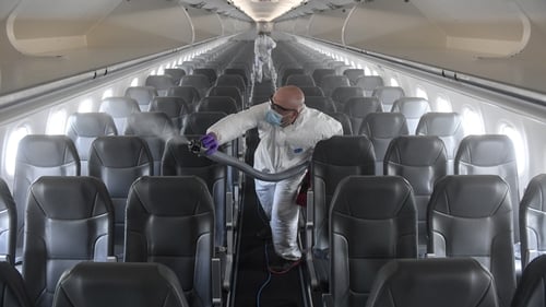 Workers disinfect an airplane at Denver International Airport. Photo: Aaron Ontiveroz/ MediaNews Group/The Denver Post via Getty Images