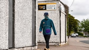 A member of the public passes TEG Cusack Park on the afternoon when the Leinster GAA Football Senior Championship Round 1 match between Louth and Longford should have been played at TEG Cusack Park in Mullingar.