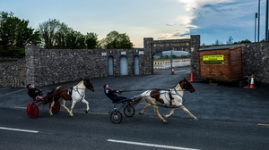 Danny, left, and Paddy Harty, from Dungarvan, Waterford, pass Fraher Field on the evening of the Munster GAA Senior Football Championship match between Waterford and Limerick