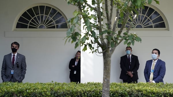 Staffers at the White House wear masks