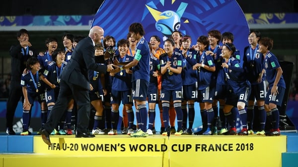 Reigning champions Japan collecting the trophy in 2018