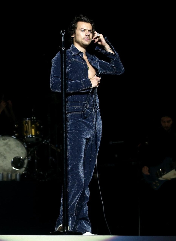 Harry Styles wearing a denim jumpsuit onstage (Isabel Infantes/PA)
