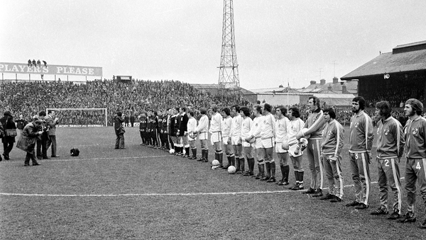 Republic of Ireland and Soviet Union players stand together for the national anthems ahead of the game.