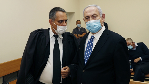 Benjamin Netanyahu (R) faces corruption charges