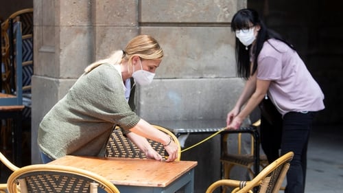 Preparations for the reopening of a cafe in Barcelona