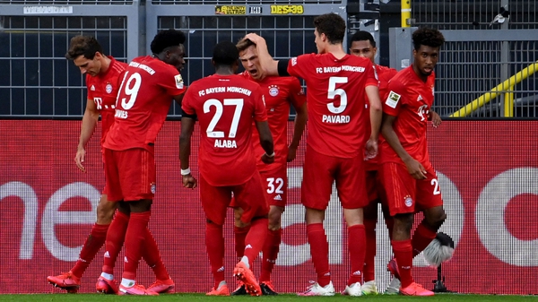 Joshua Kimmich celebrates with his Bayern Munich team-mates after his goal against Borussia Dortmund