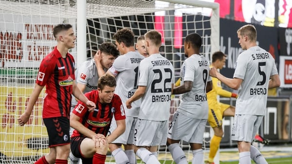 Leverkusen's Kai Havertz (2nd L) celebrates with his teammates after scoring