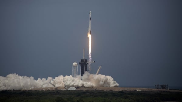 The SpaceX Falcon 9 rocket launches into space with NASA astronauts Robert Behnken and Douglas Hurley on board