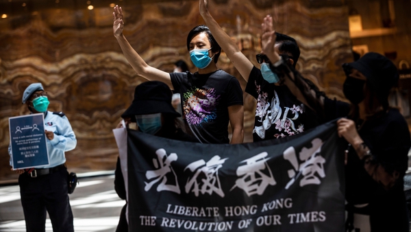 Pro-democracy protesters gather during a 'Lunch With You' rally at a shopping mall in the Central district of Hong Kong