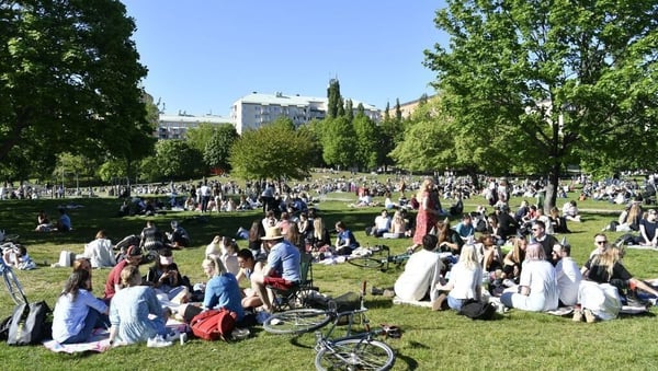 People enjoy the sunny weather in Tantolunden park in Stockholm