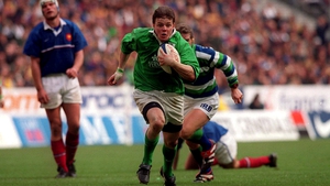 Ireland's Brian O'Driscoll on his way to scoring his third try at Stade de France in 2000