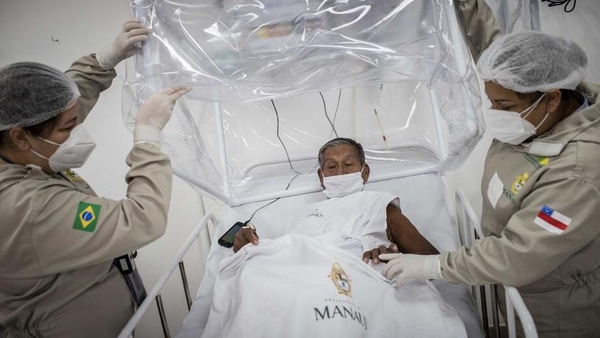 An elderly man is treated for Covid-19 at a hospital in Manaus, Brazil