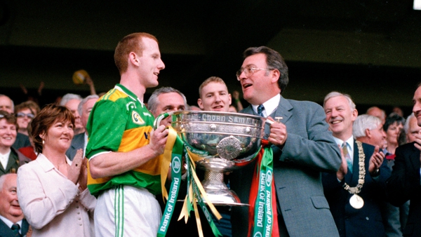 Hassett accepting the Sam Maguire Cup from GAA President Joe McDonagh