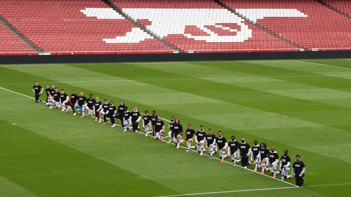 Arsenal players kneeling before the friendly with Brentford