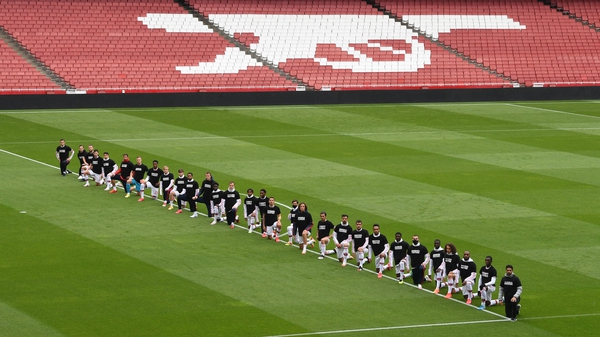 Arsenal players kneeling before the friendly with Brentford
