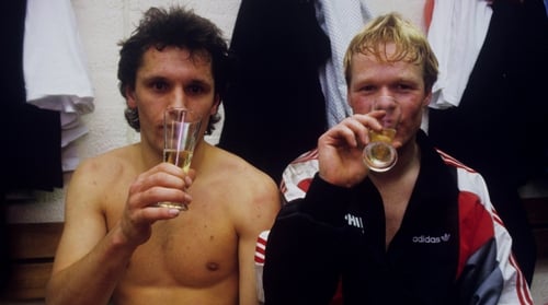 Hans Gillhaus (L) and Ronald Koeman sip Champagne after PSV Eindhoven had sealed the Dutch title in April 1988