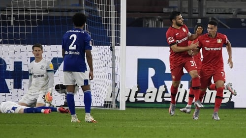 Leverkusen's Kevin Volland and Paulinho (R)celebrate the equaliser