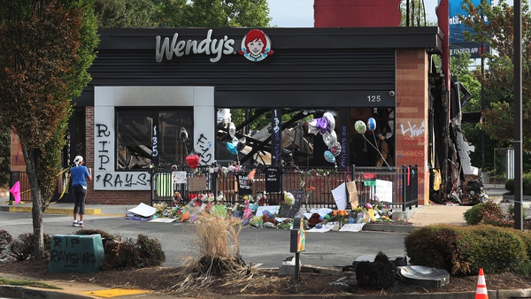 People visit the Wendy's restaurant outside which Rayshard Brooks was shot dead