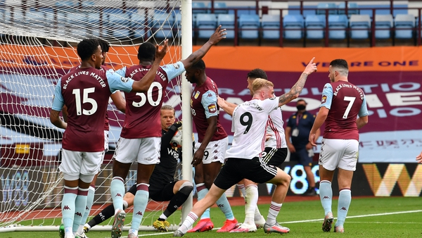 Aston Villa goalkeeper Orjan Nyland carried the ball over the line but a goal wasn't given