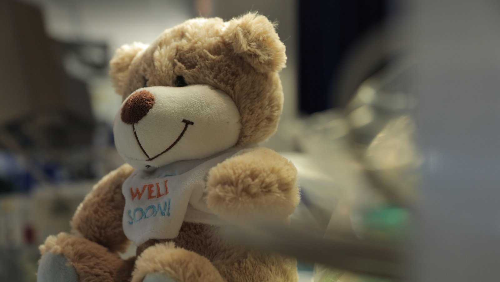 Image - A 'Get Well Soon' teddy sits by a patient's bed in ICU