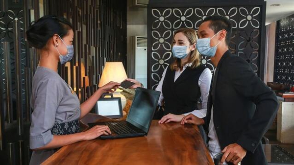 Face masks, online check-in, and more disinfectant than you could fit in the hotel pool.