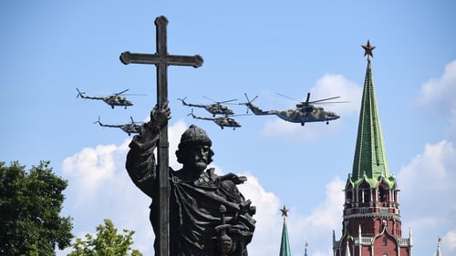 Russian military helicopters fly over Moscow's Red Square