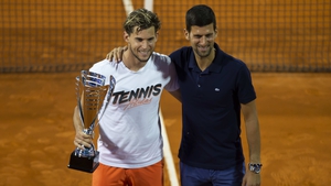 Dominic Thiem and Novak Djokovic posing for photographers after the final match in Belgrade on 14 June