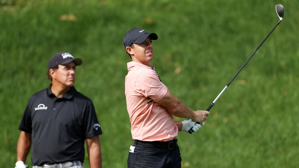 Rory McIlroy and Phil Mickelson out on course on day one