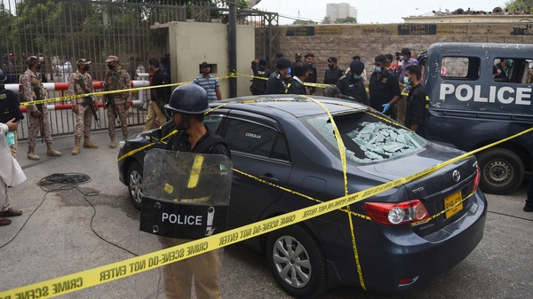 Gunmen attacked the Pakistan stock exchange in Karachi with grenades and guns