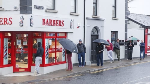 A queue forms outside a barber shop in Athy, Co Kildare