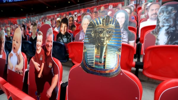 You only sing when you're winning: fans have been replaced by cardboard cutouts in the stand and artificial crowd noise on TV broadcasts