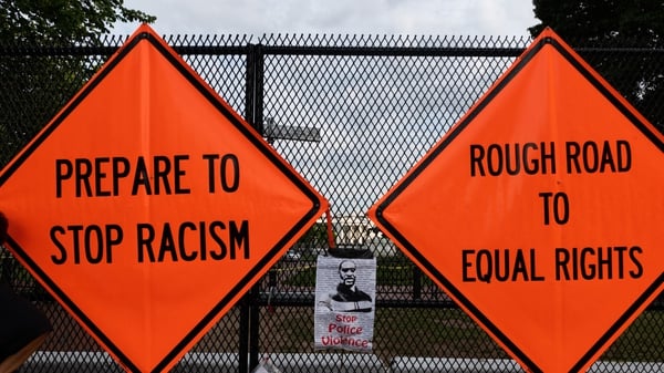 Signs on a fence at Lafayette Park near the White House