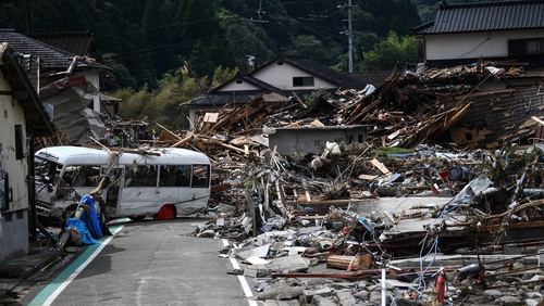 Debris litters a village following heavy rain in Kumamura, Kumamoto, Japan