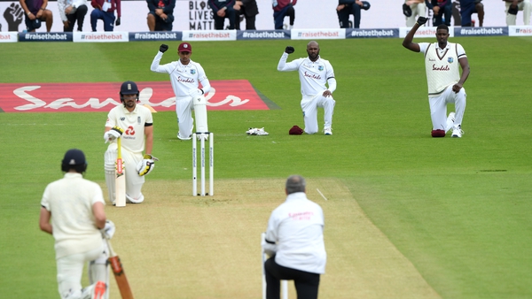 Rory Burns and Dom Sibley of England take a knee alongside Shane Dowrich, Jermaine Blackwood and Jason Holder of the West Indies