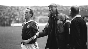 Accompanying Liam Brady off the field near the end of Ireland's 2-0 win over Bulgaria in October '87. The team had impressed during the Euro '88 qualifying campaign but the tournament appeared beyond them until Scotland beat Bulgaria one month later
