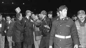15 February 1995: "GO HOME!" Charlton escorted off the pitch after the infamous riot of England fans in Lansdowne Road