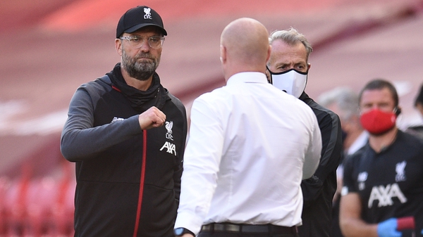Liverpool manager Jurgen Klopp (L) greets Burnley boss Sean Dyche after the game