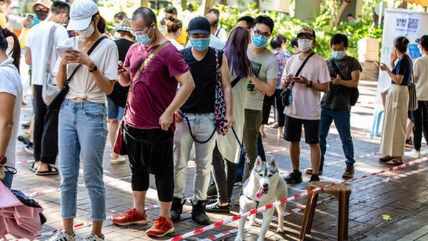 Voters queuing to cast their vote in the symbolic protest poll in Hong Kong