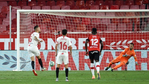 Lucas Ocampos scores from the penalty spot for Sevilla