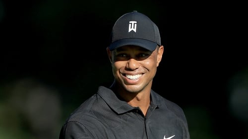 Tiger Woods smiles during a practice round prior to The Memorial Tournament