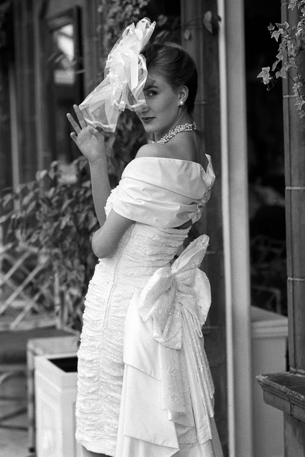 Model Jo wears a Helen Anderson creation - a sequined dress in pure silk and ruched lace with a portrait collar, priced at £750.
