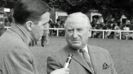 Frank Hall speaking to a horse owner at the Dublin Horse Show (1965)
