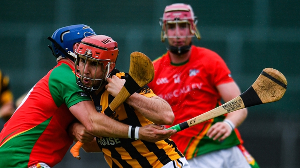 Ciarán Shaughnessy of Shelmaliers in action against Kevin Foley of Rapparees-Starlights