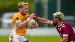 Drew Wylie tries to take the ball from Conor McManus
