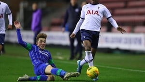 J'Neil Bennett of Tottenham Hotspur is tackled by Alfie Devine of Wigan Athletic during the FA Youth Cup in January