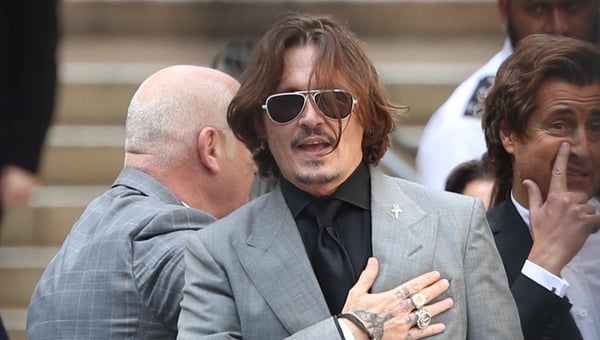 Johnny Depp pictured leaving the court in London today after proceedings ended