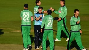 Eoin Morgan of England commiserates with Ireland after hitting the winning runs