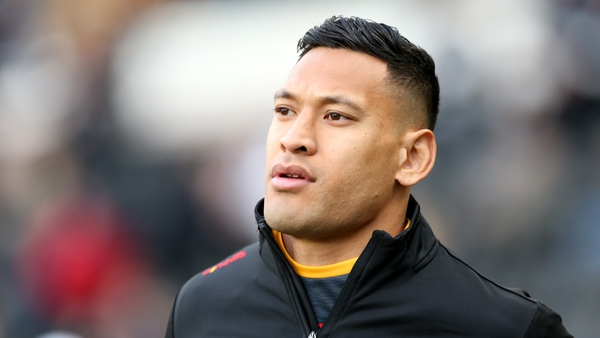 Folau remained standing as other players and officials made the gesture