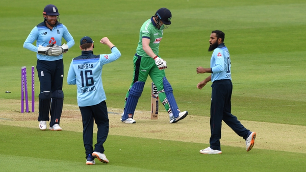 Kevin O'Brien walks off after being dismissed as Adil Rashid celebrates with Eoin Morgan during the Second One Day International between England and Ireland last week
