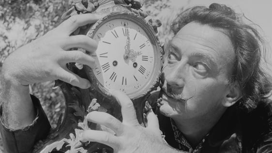 Spanish surrealist artist Salvador Dali (1904 - 1989) clutches an ornate clock at his home in Cadaques on the Costa Brava, Spain, 8th January 1955. Original Publication : Picture Post - 7465 - A Day With Salvador Dali - pub. 1955 (Photo by Charles Hewitt/